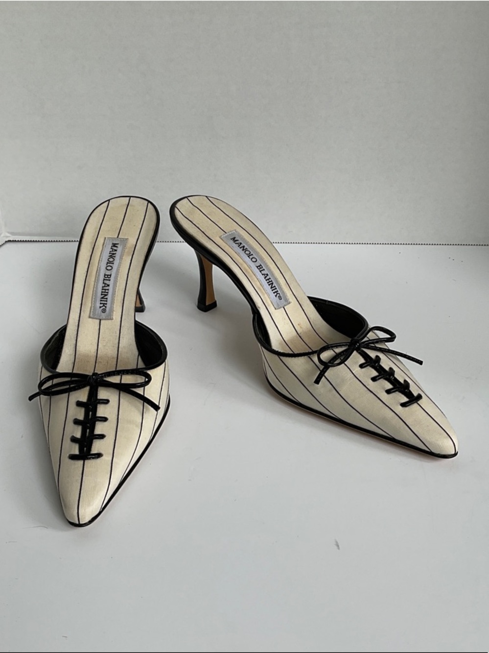 Manolo Blahnik Cream Pinstripe Pointed-Toe Lace-Up Mules with Black Trim